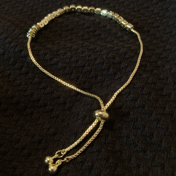 New Gold Stainless Steel Rhinestone Tennis Bracelet
Adjustable Fit - Picture 2 of 2